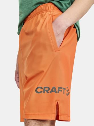 Detailní boční pohled na Pánské šortky CRAFT CORE Essence oranžová. (4)
